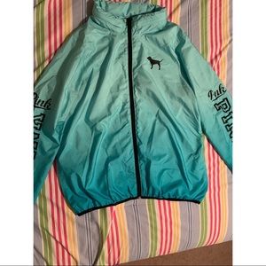 windbreaker with a connected zipped up hood